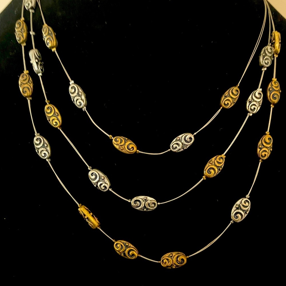 Multi silver wire station necklace with bronze and silver filigree stones